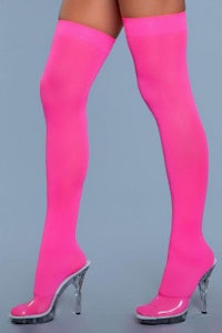 a woman in pink thigh high stockings and high heels