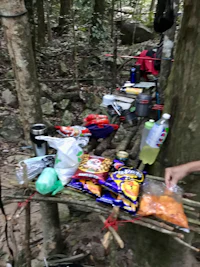 a man is preparing food in the woods