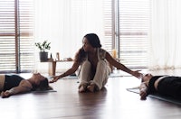 a group of women practicing yoga in a room