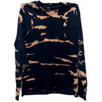 a black long - sleeved shirt with orange paint on it