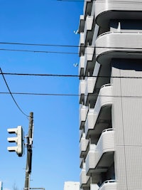 a building with wires and a street light