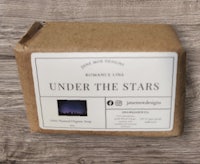 a bar of soap with the words under the stars on it