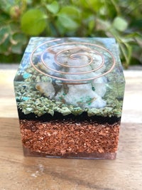 a glass cube with a spiral on top of it