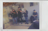polaroid of a group of people playing instruments