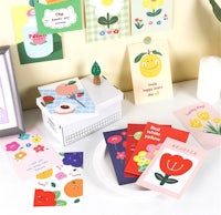 a table with a variety of greeting cards on it