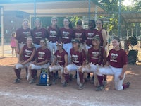 the softball team is posing for a picture