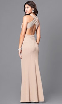 a woman in a nude prom dress with open back