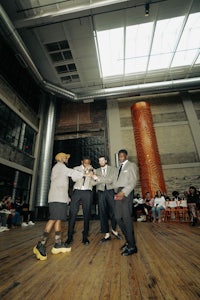 a group of people standing in a room