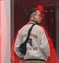 a man wearing a jacket and a backpack