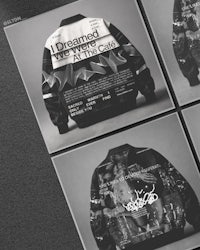 a black and white photo of a jacket with different designs on it