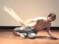 a man is laying on the floor with his shirt off