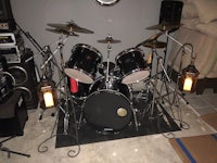 a drum set is set up in a room