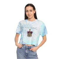 a woman wearing a blue tie dye crop top that says i am king