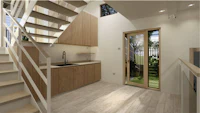 a kitchen with stairs and a wooden floor