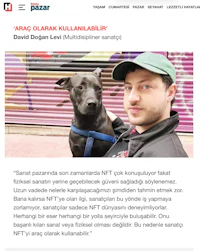 a man is holding a dog in front of a newspaper