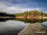 a lake surrounded by trees and rocks