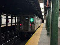 a subway train pulling into a subway station