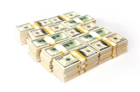 a stack of dollar bills on a white background