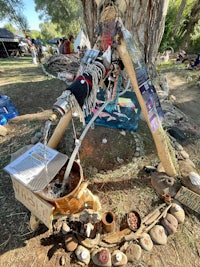 a teepee with a tree in the middle of it