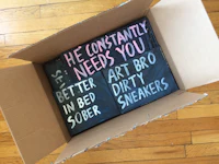 a box with a sign that says he needs you