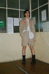 a man in a suit standing in a room