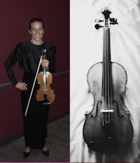 a black and white photo of a woman with a violin