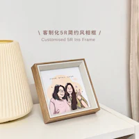 a wooden frame with a picture of two girls on it