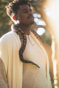 a man with a snake around his neck