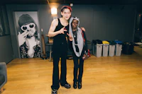 a man and a woman standing next to each other in a room