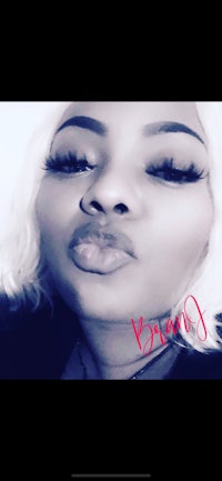 an image of a woman with blond hair and lipstick on her face