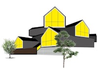 a black and yellow building with a tree in front of it