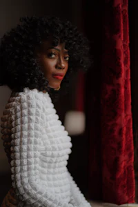 a woman wearing a white sweater