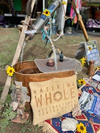 a watering hole with a sign that says watering whole