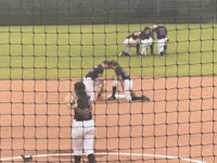 a group of softball players on the field