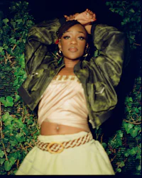 a woman in a green skirt posing for a photo