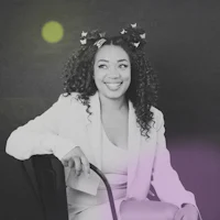 a black and white photo of a woman sitting on a chair