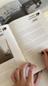 a person writing in a book