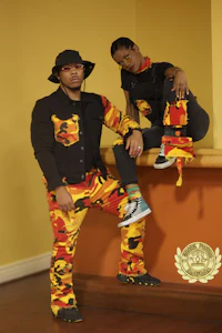 a man and woman posing for a photo in camouflage outfits