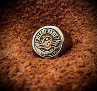 a ring with a skull and crossbones on it