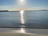 the sun is shining on the water