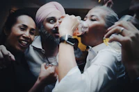 a group of people drinking at a party
