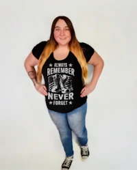 a woman wearing jeans and a t - shirt that says remember never forget