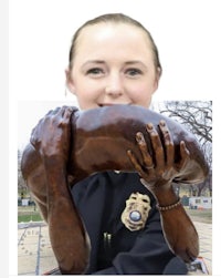 a statue of a woman holding a woman's hand
