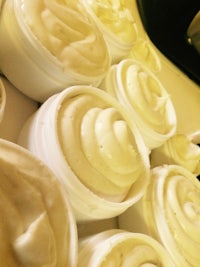 a bunch of whipped cream sitting on top of a counter