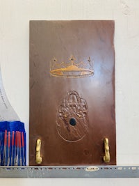 a brown board with a crown on it