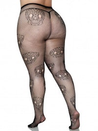 the back view of a woman wearing black fishnet stockings with skulls