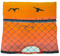 a blanket with birds flying over a fence at sunset
