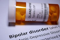 a prescription bottle with the word bipolar disorder on it