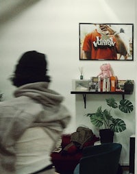 a person is playing a video game in a living room