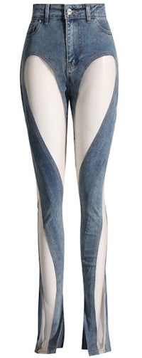 a woman wearing a pair of jeans with sheer panels